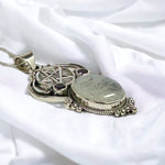 Faceted Amethyst and Polished Moonstone pentacle pendant side view